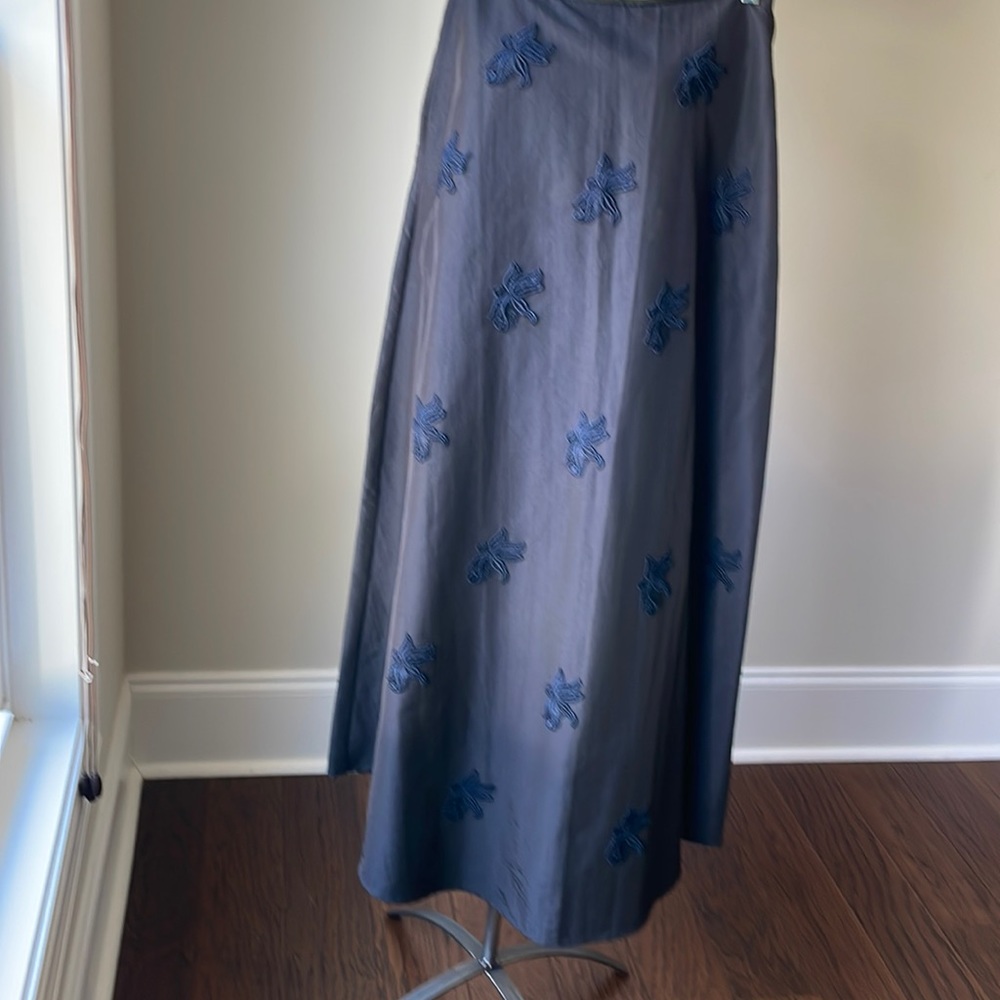 Long black skirt with hand sew designs